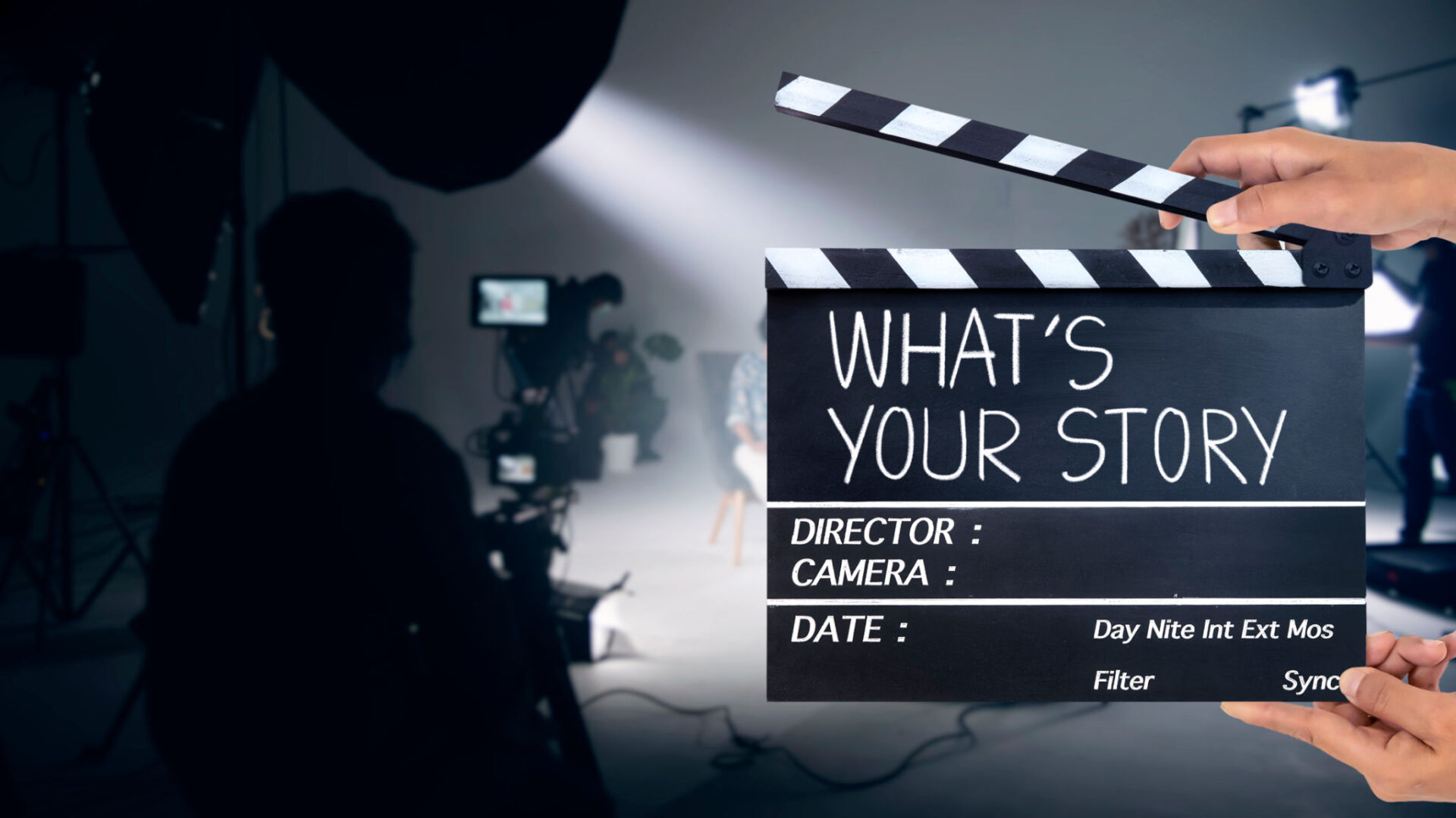 Film set with clapperboard and crew.